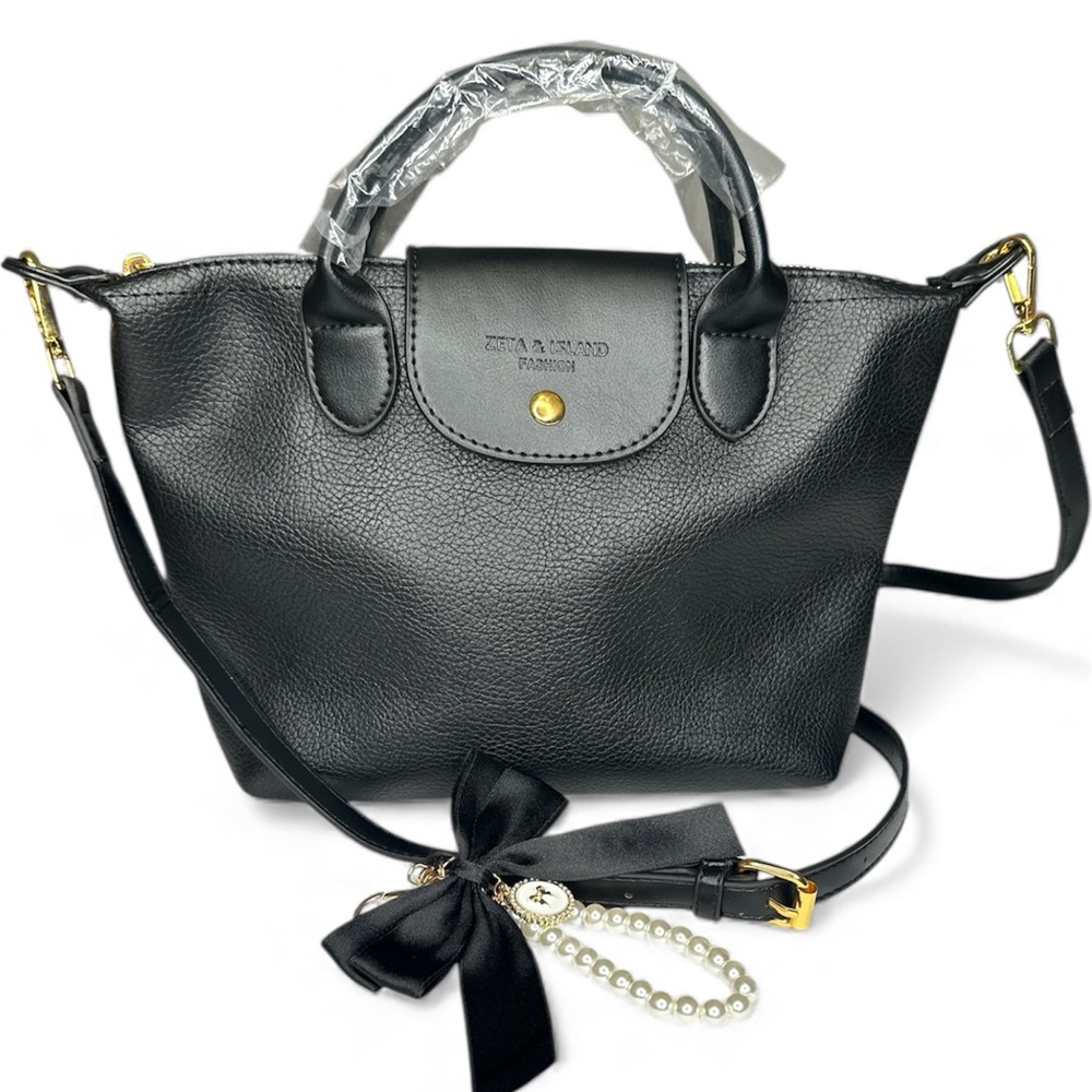 NWOT Zeta & Island Fashion Bag Black with bag charm.